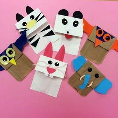 some paper bags with different animals on them