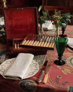 the table is set with place settings for dinner