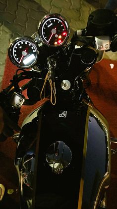 the handlebars and gauges are visible on this motorbike's engine