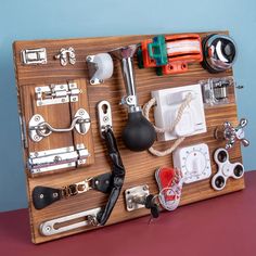 a wooden board with various items attached to it