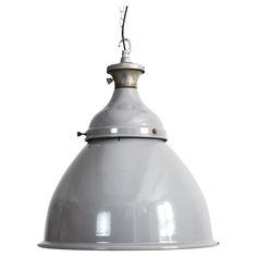 a white light hanging from a ceiling fixture