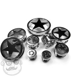 an assortment of black and silver metal knobs with star designs on them, all in different sizes