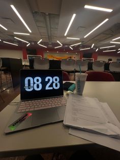 an open laptop computer sitting on top of a desk