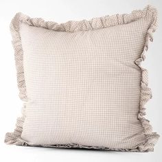 a pillow with ruffled edges on a white background