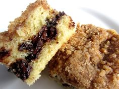 two pieces of cake sitting on top of a white plate