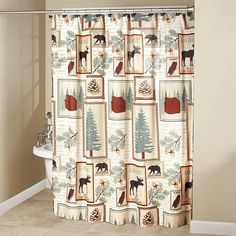 the shower curtain is decorated with animals and trees