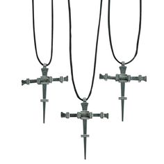 three crosses are attached to the side of each other with black cords hanging from them