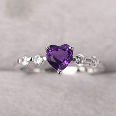 Silver Heart Rainbow Topaz Heart Rings Simple, Purple Sapphire Birthstone Ring With Diamonds, Silver Heart Cut Amethyst Ring Gift, Silver Amethyst Heart Cut Ring Gift, Purple Sapphire Ring With Diamond Birthstone, Purple Diamond Ring With Birthstone, Elegant Amethyst Heart Promise Ring, Fine Jewelry Heart Cut Amethyst Ring, Fine Jewelry Amethyst Ring Heart Cut