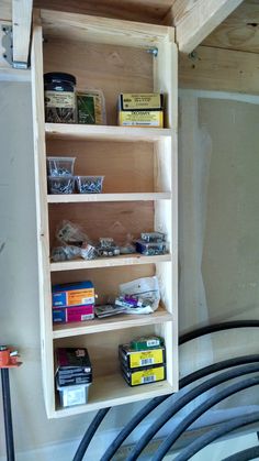 a wooden shelf filled with books and other items