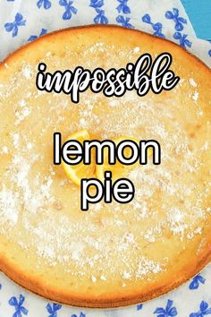 a lemon pie on a blue and white cloth with the words impossibleble written above it