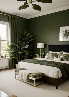 a bedroom with green walls, white carpet and a large bed in the middle of it