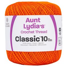 an orange ball of yarn with the words,'classic 10'in white lettering