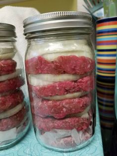 mason jars filled with hamburger patties and onions