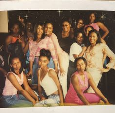 a group of women posing for a photo