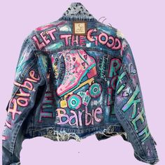 the back of a jean jacket with words painted on it