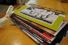 a stack of magazines sitting on top of a wooden table