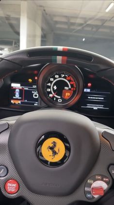 the dashboard of a ferrari car in a showroom