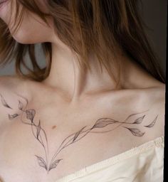 a woman with a tattoo on her chest