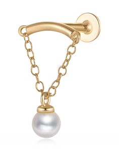 a gold plated necklace with a pearl hanging from it's back, on a white background