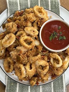 fried food on a plate with dipping sauce