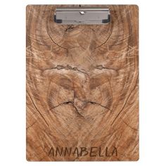 a wooden clipboard with the word annnabella on it and an image of a tree trunk