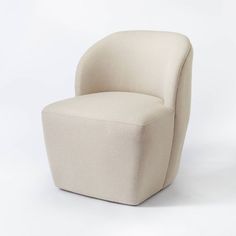 a white chair sitting on top of a white floor