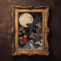 an ornate gold frame holds a painting with flowers and a full moon in the background