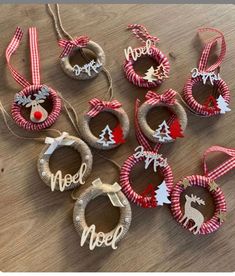 christmas ornaments are arranged on a table with the word noel spelled in red and white