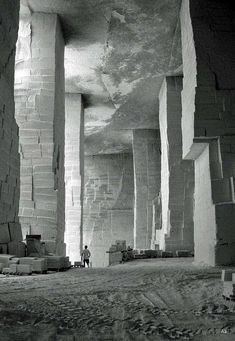 a black and white photo of an unfinished building