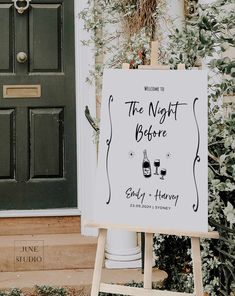 a white sign sitting in front of a green door