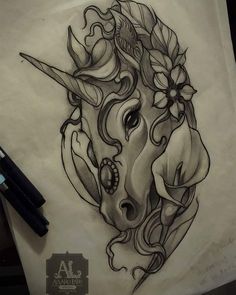 a drawing of a unicorn's head with flowers in its hair and horns on it