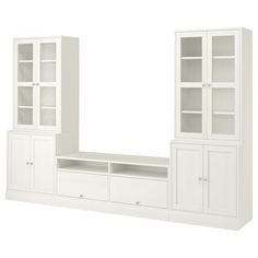 a white entertainment center with glass doors and shelves