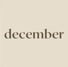 the word december written in brown on a beige background