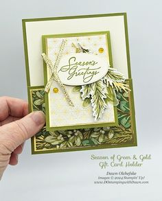 someone holding up a christmas card made with stampin's seasonal greetings dies