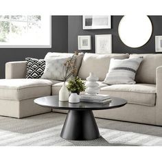 a living room scene with focus on the couch and coffee table in the foreground