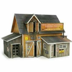 an old model building with two garages and a sign on the side of it