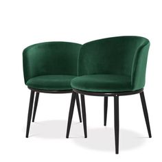 pair of green velvet chairs with black legs and backrests, viewed from the front