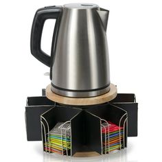 a coffee pot and some sort of multi - colored binder on a white background