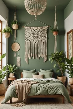 a bedroom with green walls and hanging plants