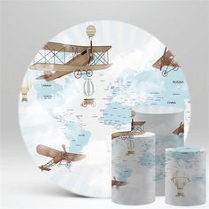 the world map is shown with airplanes and planes on it's sides, as well as two rolls of toilet paper