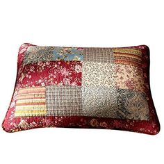 a red and gold patchwork pillow on a white background