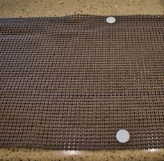 there is a brown mat with white dots on it