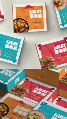 several boxes with different types of food on top of each other, including meat box