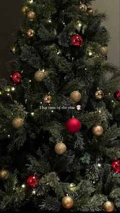 a christmas tree with red and gold ornaments