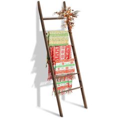 a wooden ladder with blankets hanging from it's sides and flowers on the top