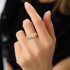 Experience luxury with our Solid Gold Chunky Croissant Ring, a masterfully crafted statement piece in 14K gold. This elegantly twisted dome ring brings a sense of refinement to your wardrobe, catering to the discerning taste of women. Meticulously handmade, it's a stackable ring that embodies uniqueness and style, perfect for those who appreciate fine craftsmanship. Elevate your attire effortlessly with this versatile accessory, designed to complement any ensemble with timeless allure. Ring Deta Luxury Gold Rings For Women, Modern Chunky Yellow Gold Jewelry, Handmade Elegant Yellow Gold Dome Ring, Luxury Gold Statement Dome Ring, Adjustable Gold 14k Gold-filled Midi Rings, Gold Croissant Ring, Domed Ring, Rings For Her, Stackable Rings