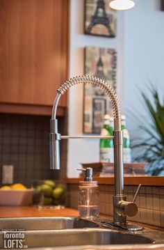 a kitchen sink with a faucet and water dispenser next to it