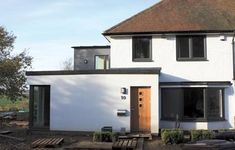 a large white house with a wooden door