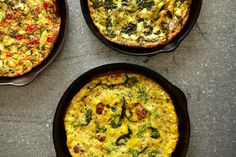 three pans filled with different types of food on top of a gray countertop