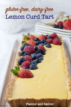 there is a lemon curd tart with berries on top